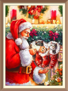 Santa Claus and 2 Kitten